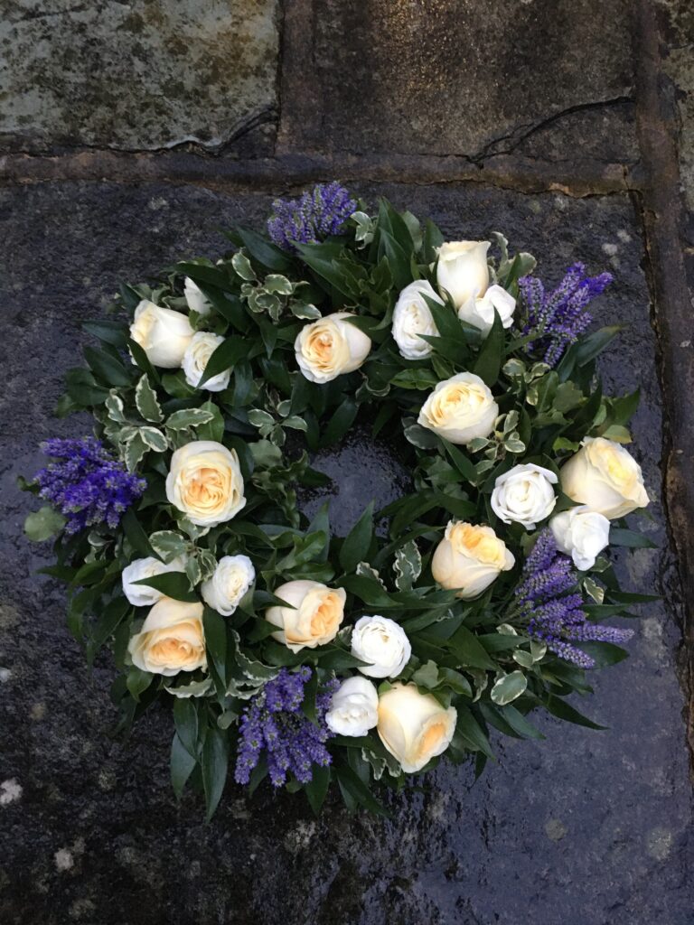 Funeral flower wreath butter cream roses