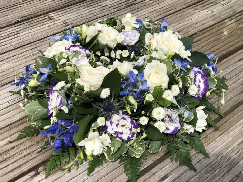 funeral flower arrangement white roses